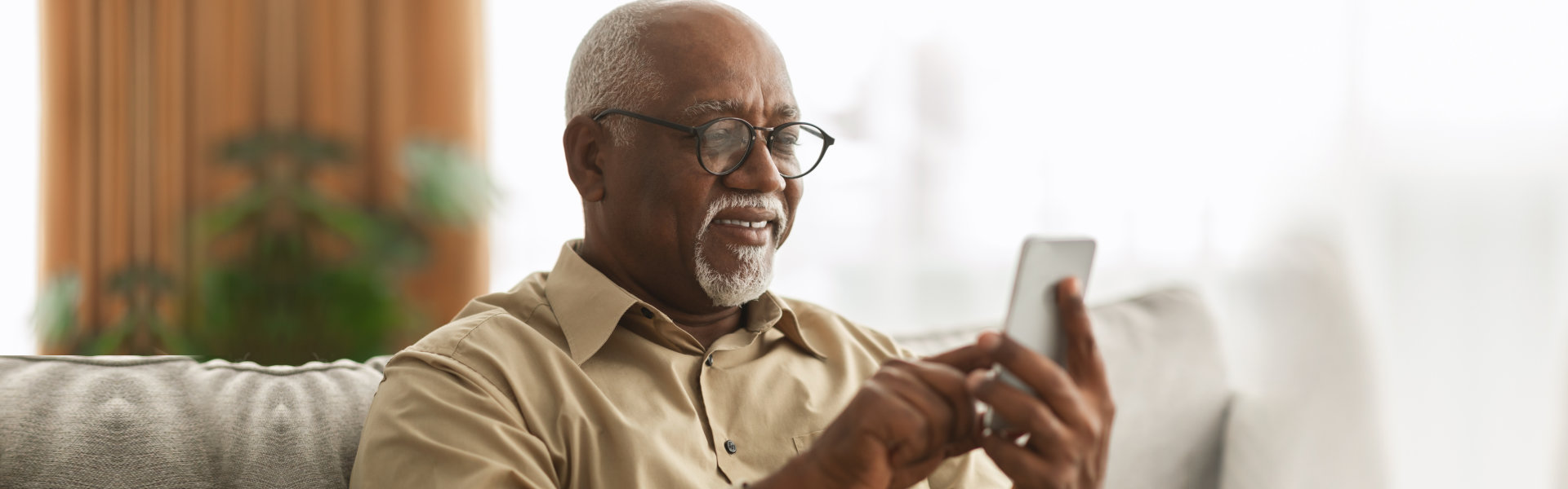 elderly man holding cellphone